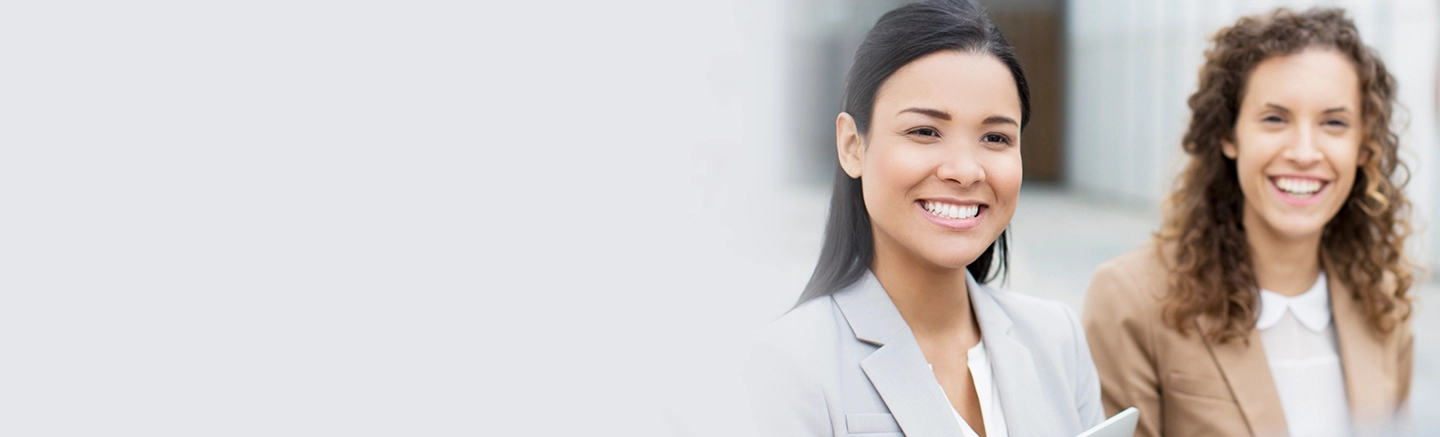 Two professional woman smiling