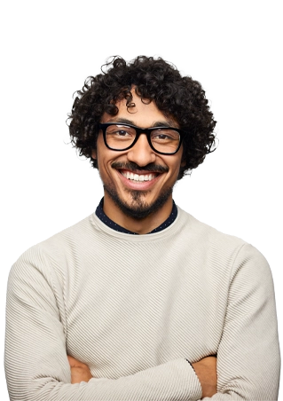 Diverse man with curly hair and glasses smiling at the camera