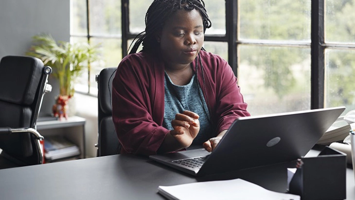 Woman in front of a computer.