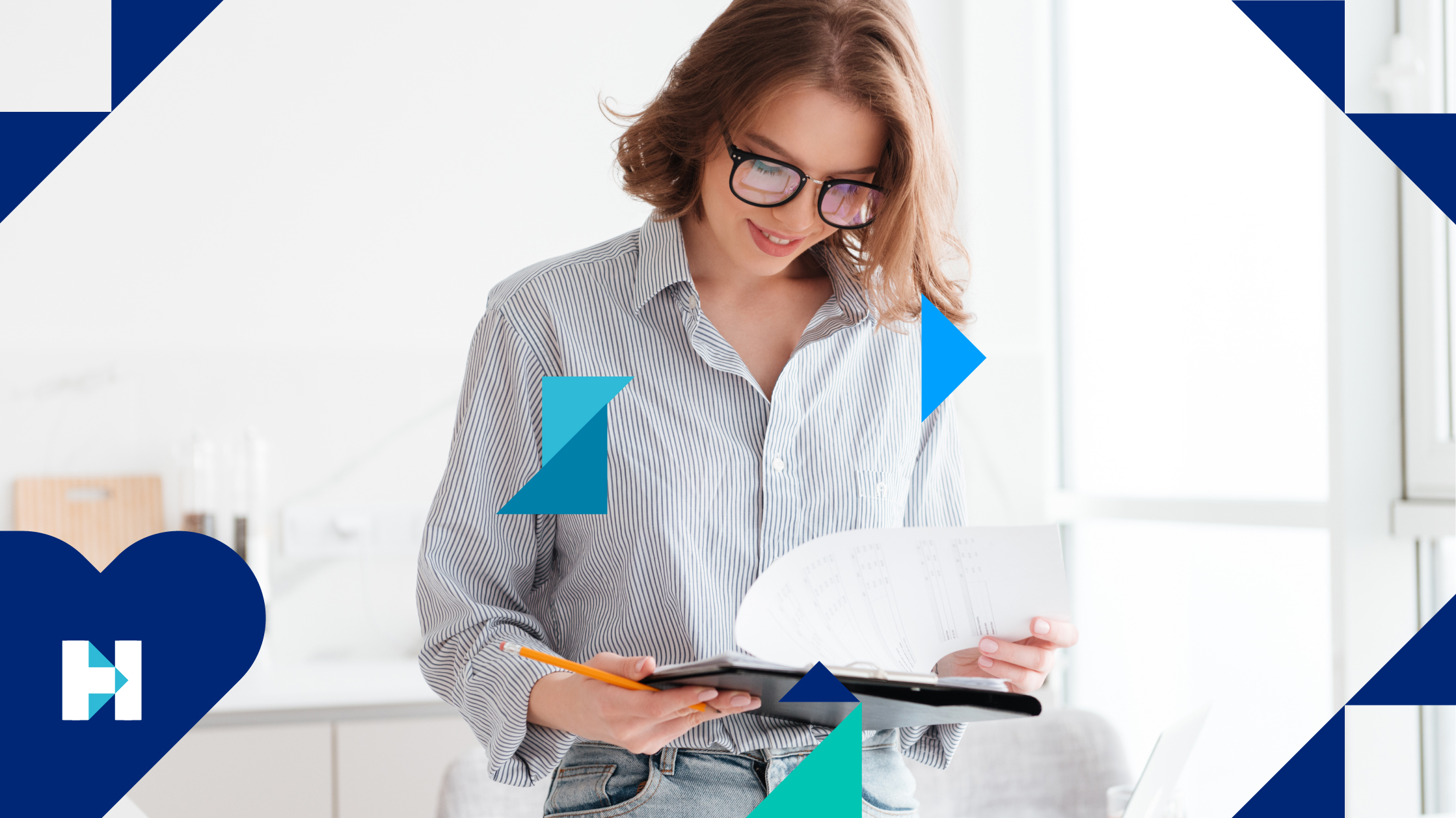 A woman wearing glasses and a blue striped shirt reviews her notes on a notepad, holding a pencil in her right hand.