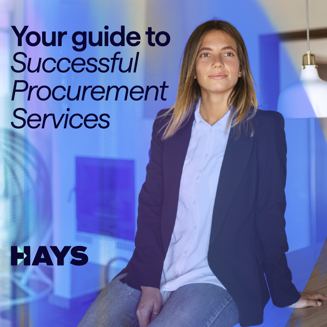 A woman in a navy-blue blazer and baby blue shirt and jeans sits on a table in an office. To her left are the words: Your guide to Successful Procurement Services.