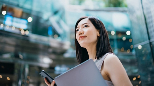 Woman looking at the building.