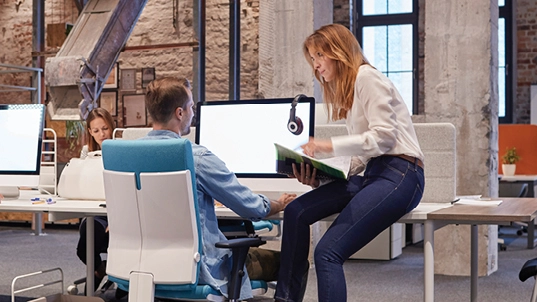 Woman and Men talking in the office.