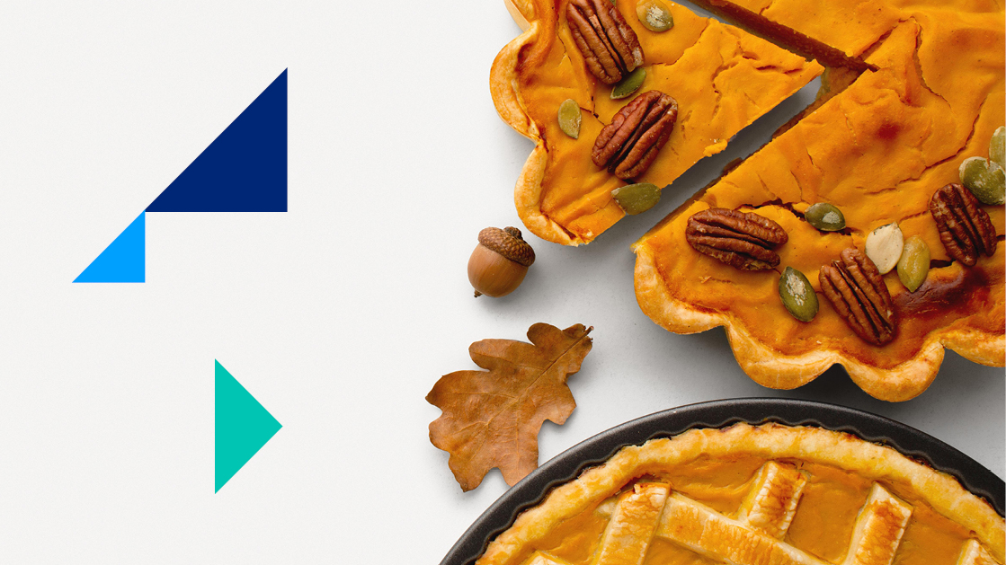 Two Thanksgiving pies, one with different types of nuts, on a white background with a brown leaf and an acorn.