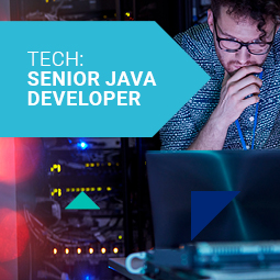 A man wearing a blue shirt and glasses looks into a laptop with an interested and thoughtful expression, his hand is on his chin. Tech: Senior Java Developer job description template.