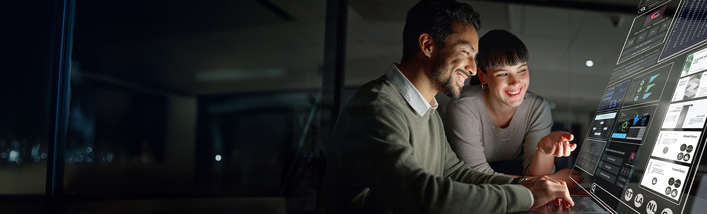 Man and woman looking at projection screen.